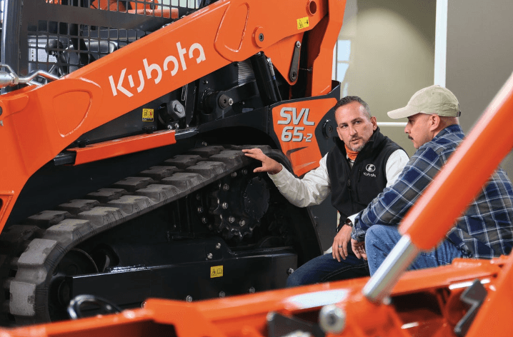 Kubota employee showing a track loader
