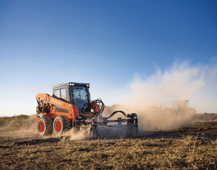 Skid steer leveling out ground