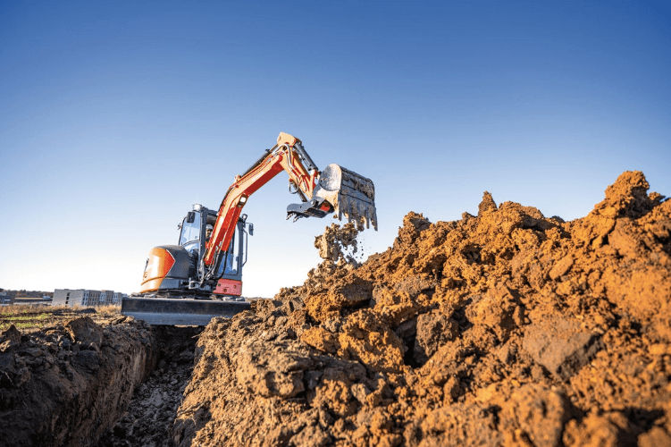 Excavator digging on site