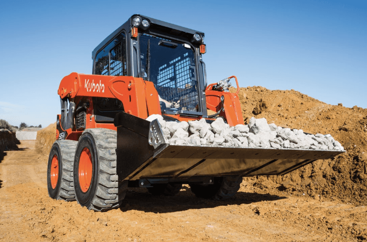 Skid Steer moving large rocks