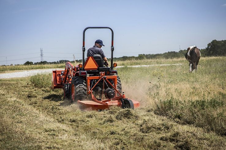 How do mowers attached to tractors work?