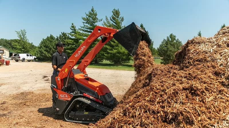 Kubota SCL track loader scooping dirt