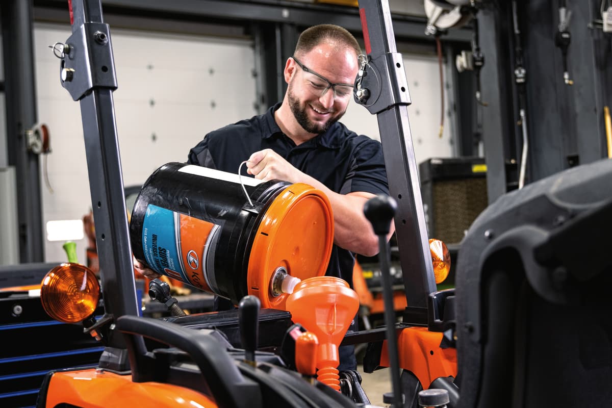 Kubota service tech changing oil