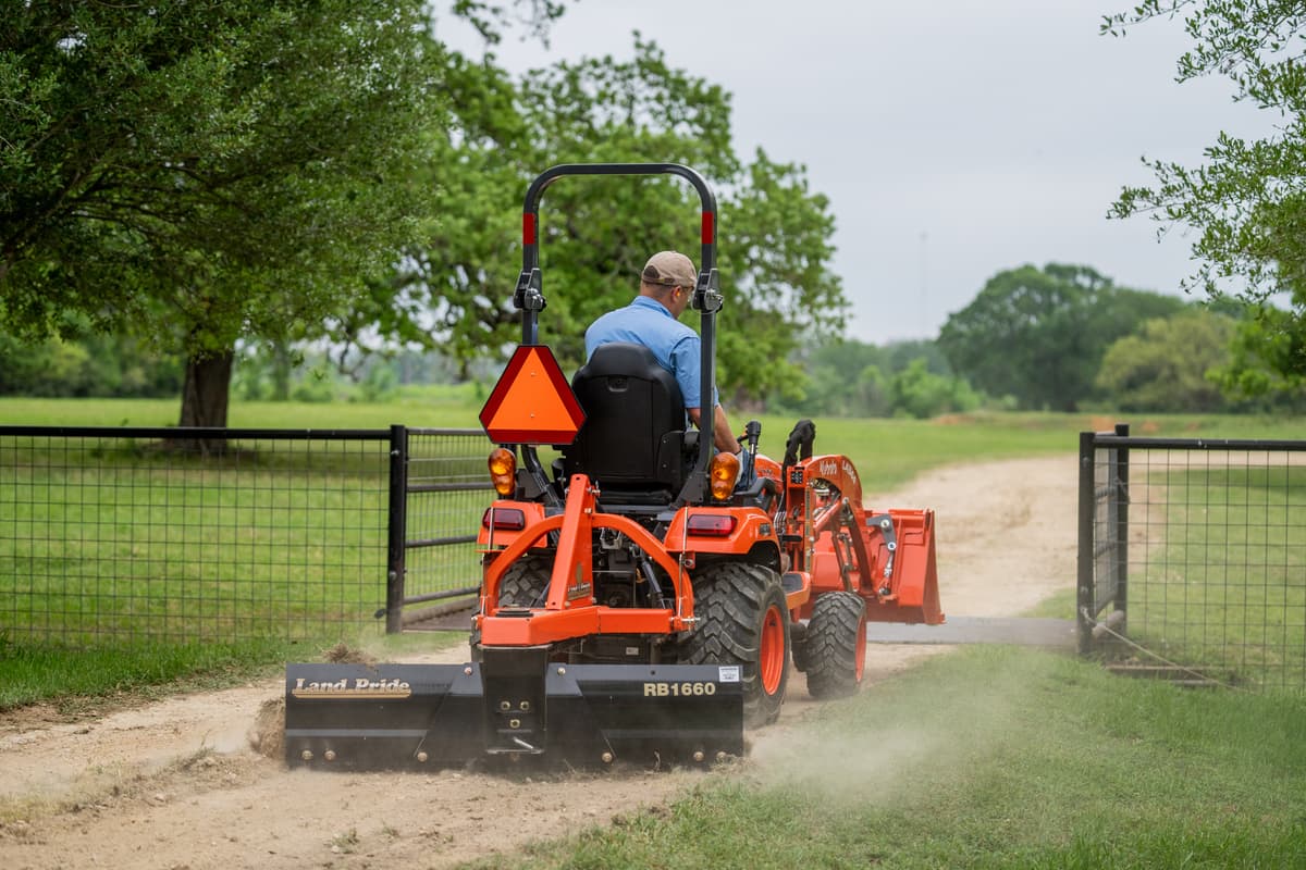 Land Pride grading scraper on a Kubota Tractor