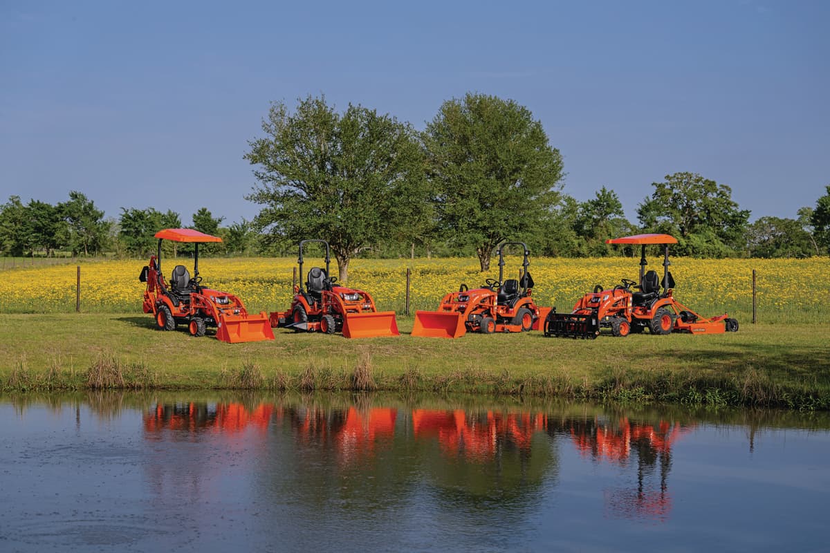 Kubota BX Series lineup in front of a pond
