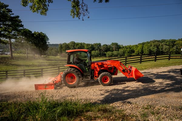 Kubota L6070 grading driveway