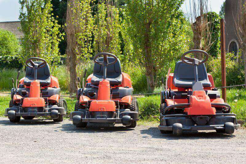 three riding lawn mowers in a row from Mission Valley Kubota