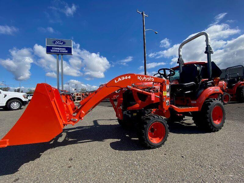 Kubota tractor in parking lot by Mission Valley Kubota